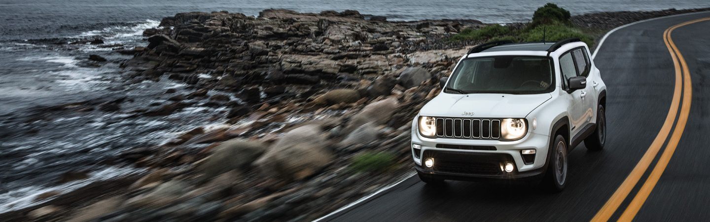 The 2021 Jeep Renegade being driven along the sea shore.